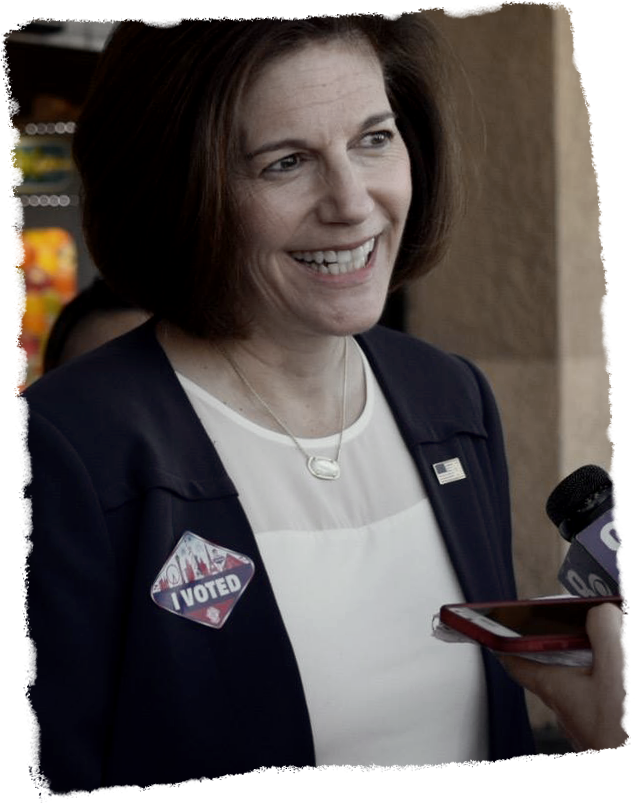 Catherine Cortez Masto speaking at a microphone